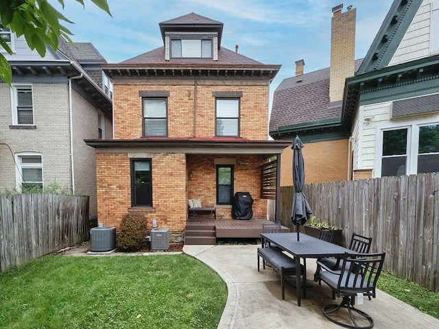 410 Bailey Ave, Mt Washington, PA 15211 - rear view of property featuring brick siding, a deck, a fenced backyard, and a patio