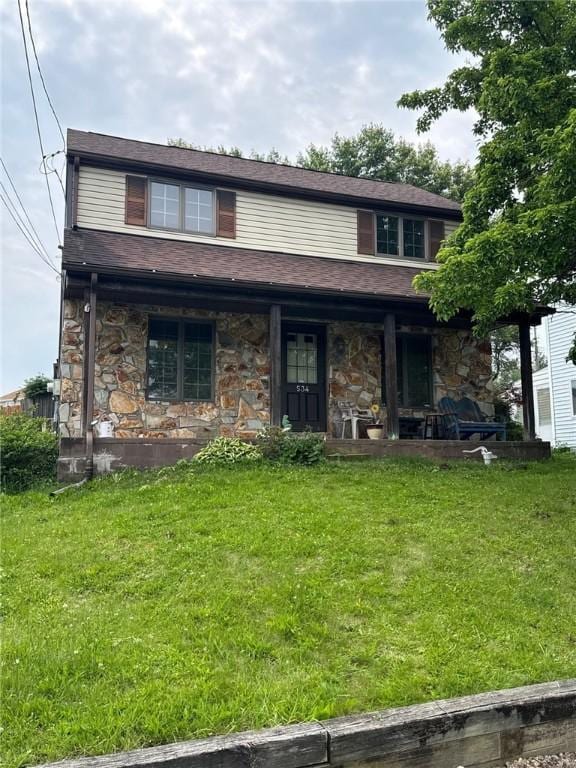 534 Independence Dr, Clairton, PA 15025 - view of front facade with stone siding, a porch, and a front yard