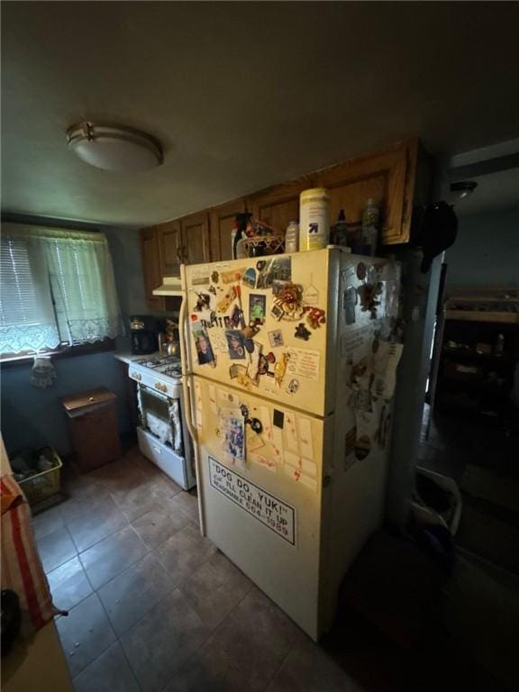 534 Independence Dr, Clairton, PA 15025 - kitchen with white appliances, under cabinet range hood, brown cabinets, and tile patterned flooring