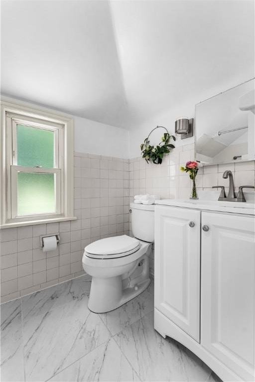 1155 Cedar Blvd, Mt Lebanon, PA 15228 - bathroom with tile walls, vanity, and marble look tiles