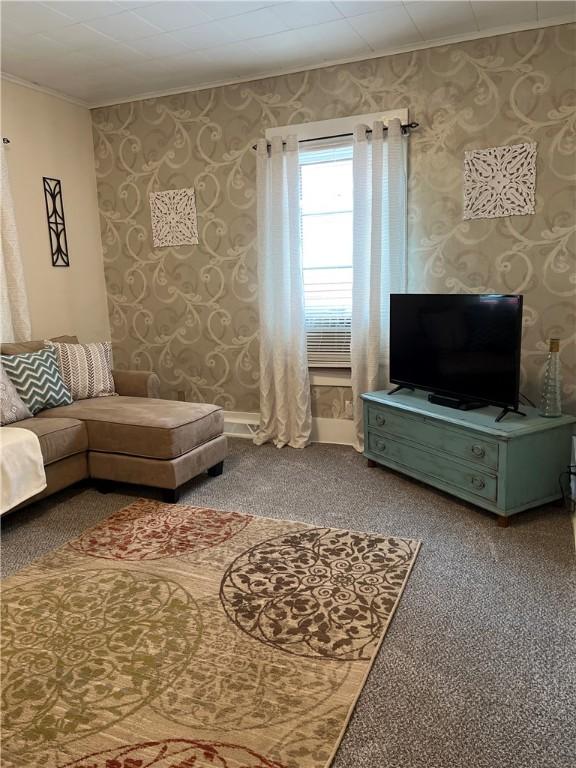 1220 Negley St, Farrell, PA 16121 - living room featuring crown molding, carpet, and wallpapered walls
