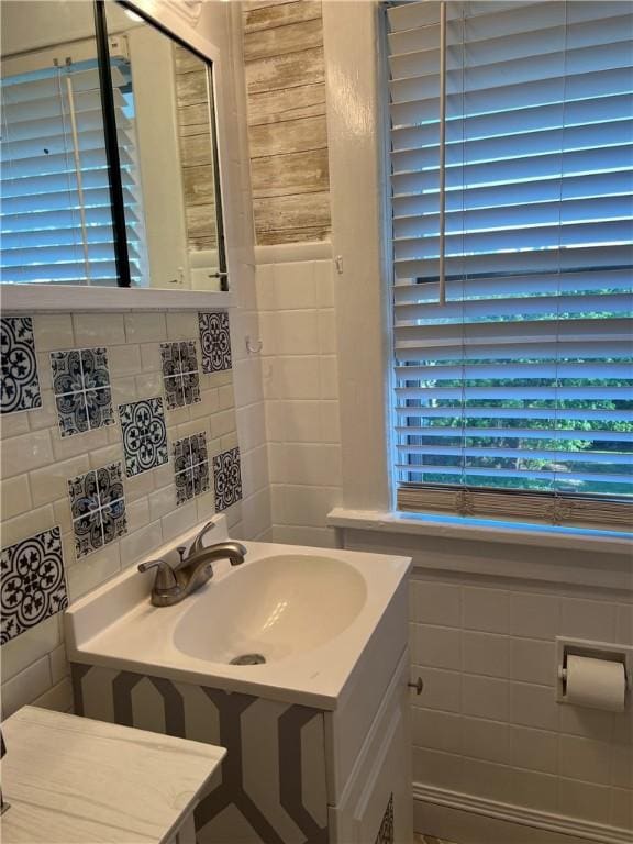1220 Negley St, Farrell, PA 16121 - bathroom with tile walls, vanity, and decorative backsplash
