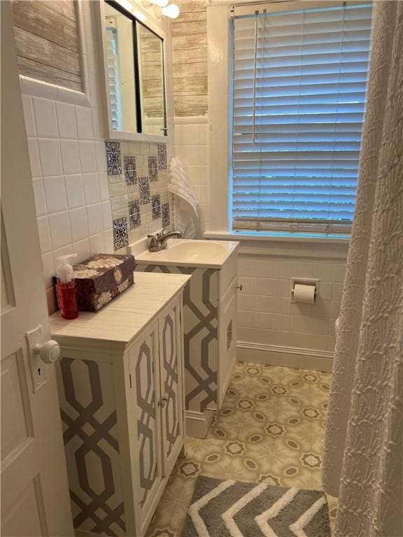 1220 Negley St, Farrell, PA 16121 - bathroom featuring tile walls, vanity, and tile patterned floors