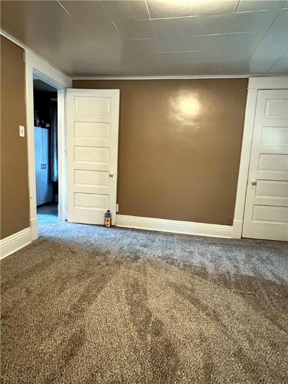 1220 Negley St, Farrell, PA 16121 - carpeted empty room with baseboards