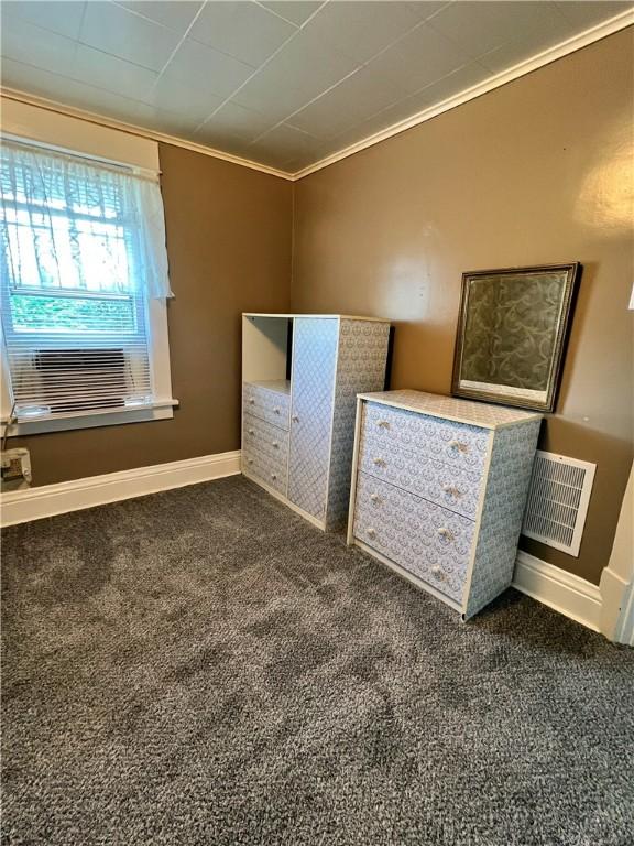 1220 Negley St, Farrell, PA 16121 - unfurnished bedroom featuring crown molding, dark carpet, and cooling unit