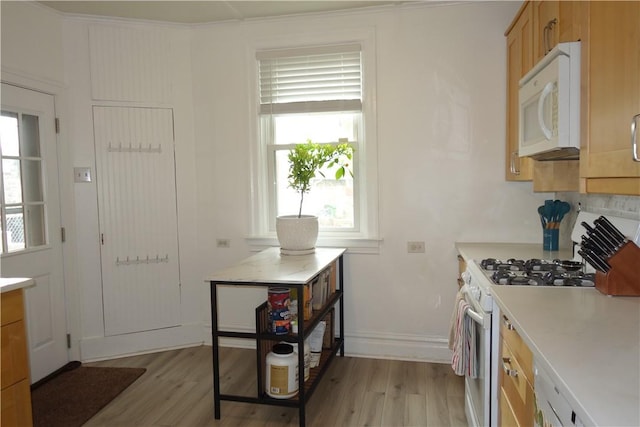 540 Mifflin Ave, Regent Square, PA 15221 - kitchen featuring white appliances, light wood finished floors, light countertops, and plenty of natural light