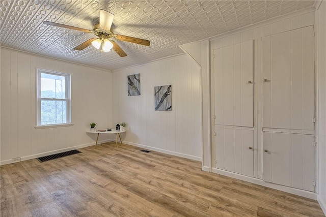 881 Main St, North Huntingdon, PA 15642 - spare room with an ornate ceiling, wood finished floors, and ceiling fan