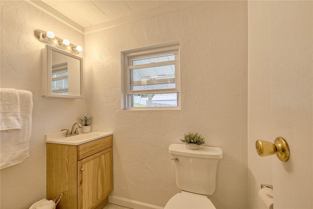 881 Main St, North Huntingdon, PA 15642 - bathroom with vanity, a textured wall, and ornamental molding
