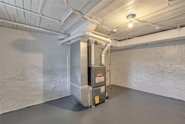 881 Main St, North Huntingdon, PA 15642 - unfinished below grade area with a textured wall and heating unit