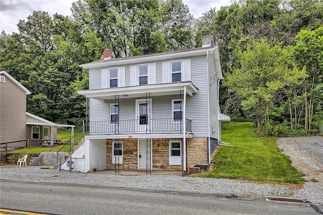 881 Main St, North Huntingdon, PA 15642 - view of front of house with a chimney, a porch, stairway, stone siding, and view of scattered trees