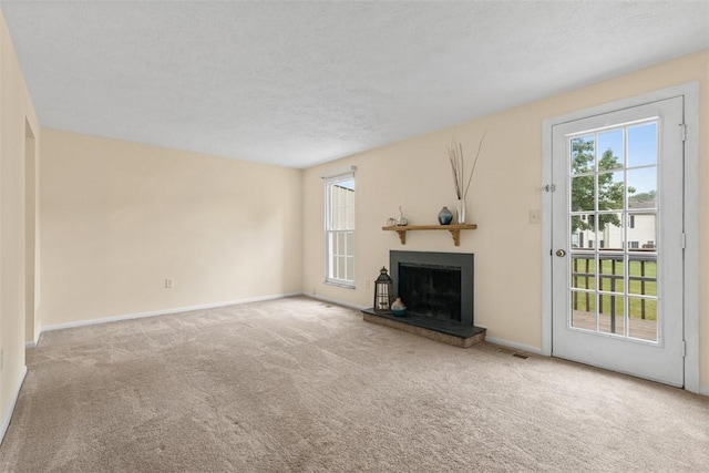 3080 E Bardonner Rd, Hampton, PA 15044 - unfurnished living room featuring carpet flooring and a fireplace with raised hearth