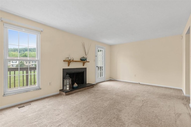 3080 E Bardonner Rd, Hampton, PA 15044 - unfurnished living room with carpet flooring and a fireplace with raised hearth