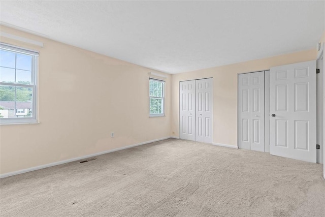 3080 E Bardonner Rd, Hampton, PA 15044 - unfurnished bedroom with two closets and carpet floors