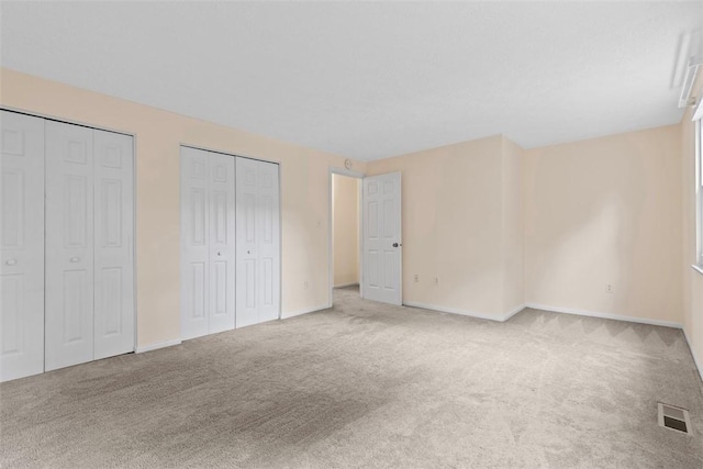 3080 E Bardonner Rd, Hampton, PA 15044 - unfurnished bedroom with multiple closets and carpet flooring