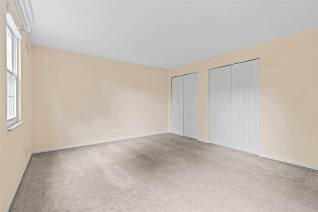 3080 E Bardonner Rd, Hampton, PA 15044 - unfurnished bedroom featuring two closets and carpet floors