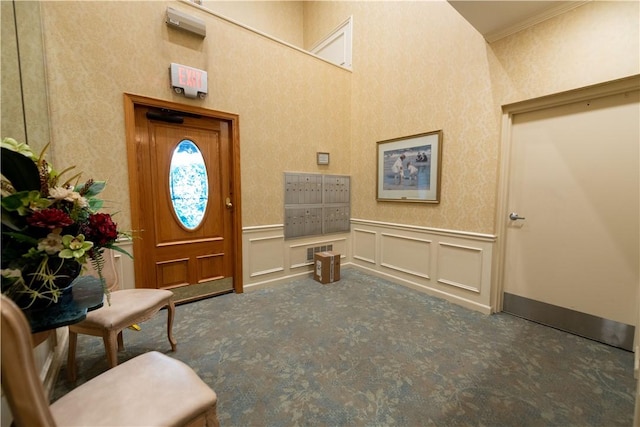 425 N Neville St Unit 302, Oakland, PA 15213 - foyer entrance featuring carpet, ornamental molding, a wainscoted wall, mail area, and a decorative wall