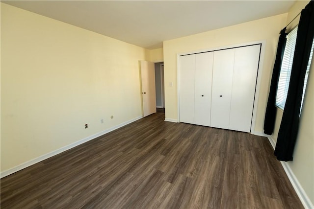 425 N Neville St Unit 302, Oakland, PA 15213 - unfurnished bedroom with dark wood-style floors and a closet