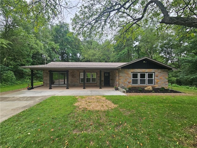 352 Hartzell School Rd, Marion Twp, PA 16123 - view of front of home with stone siding, a front yard, covered porch, and concrete driveway