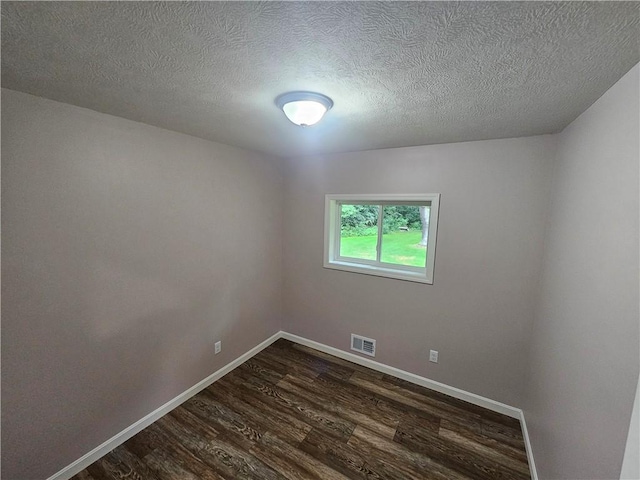 352 Hartzell School Rd, Marion Twp, PA 16123 - spare room with dark wood-type flooring and a textured ceiling