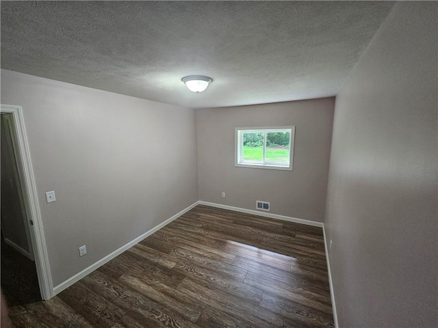 352 Hartzell School Rd, Marion Twp, PA 16123 - unfurnished room featuring dark wood-type flooring and a textured ceiling