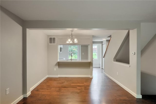 7311 Lafayette Sq, Hopewell Twp, PA 15001 - unfurnished dining area featuring dark wood-type flooring and a chandelier