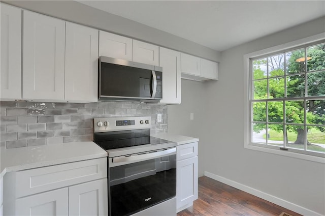 7311 Lafayette Sq, Hopewell Twp, PA 15001 - kitchen with stainless steel appliances, healthy amount of natural light, light countertops, and backsplash