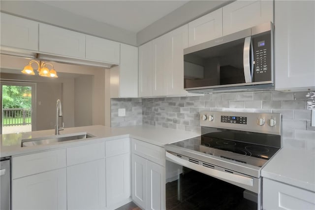 7311 Lafayette Sq, Hopewell Twp, PA 15001 - kitchen featuring stainless steel appliances, light countertops, and white cabinetry