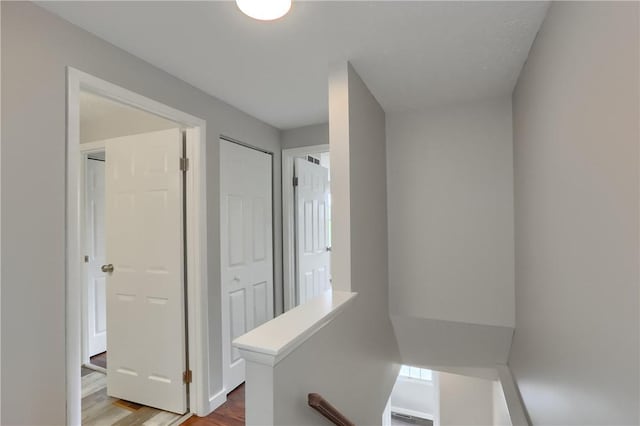 7311 Lafayette Sq, Hopewell Twp, PA 15001 - hall featuring wood finished floors and an upstairs landing