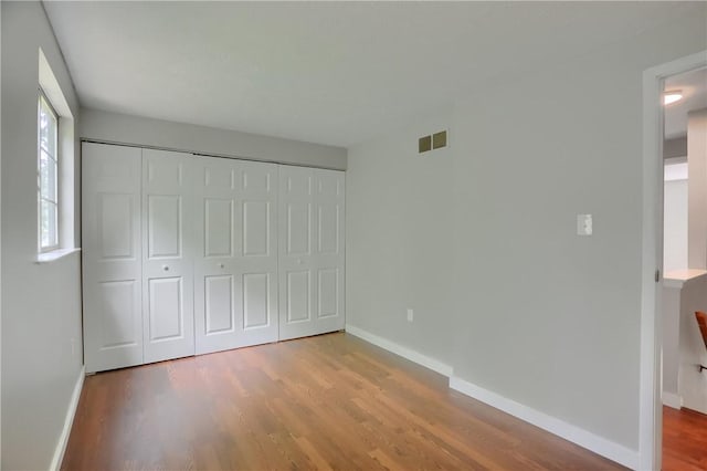 7311 Lafayette Sq, Hopewell Twp, PA 15001 - unfurnished bedroom with wood finished floors and a closet