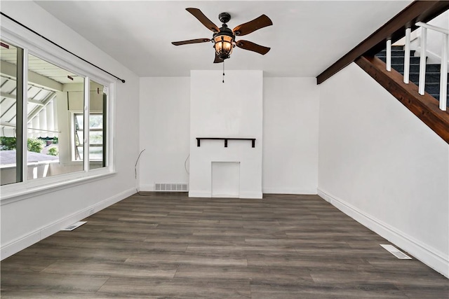 428 Card Ave, Wilmerding, PA 15148 - unfurnished living room featuring a ceiling fan, wood finished floors, and stairway