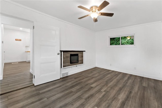 428 Card Ave, Wilmerding, PA 15148 - unfurnished living room featuring a fireplace, ceiling fan, dark wood-style floors, and ornamental molding