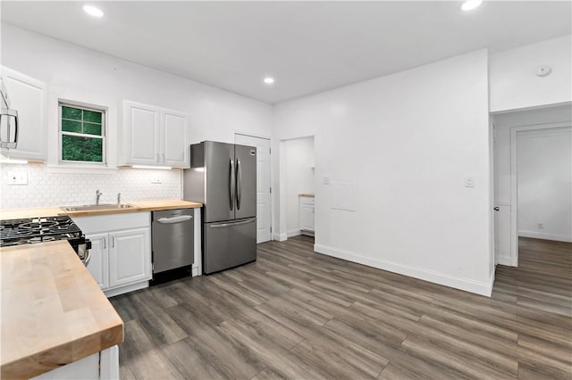 428 Card Ave, Wilmerding, PA 15148 - kitchen with stainless steel appliances, wood counters, dark wood-style flooring, recessed lighting, and white cabinets