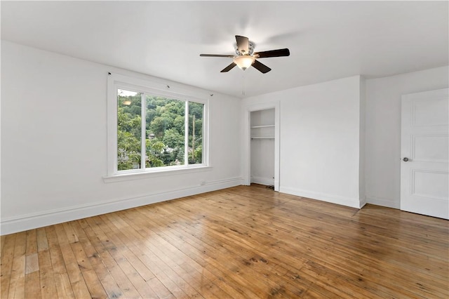 428 Card Ave, Wilmerding, PA 15148 - unfurnished bedroom with wood-type flooring, a closet, and a ceiling fan