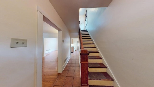 2945 Devlin St, Arlington, PA 15210 - stairs featuring tile patterned flooring and baseboards