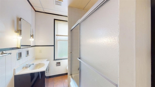 2945 Devlin St, Arlington, PA 15210 - bathroom featuring vanity, shower / bath combination with glass door, and tile patterned floors