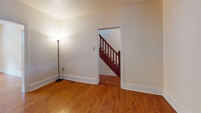 2945 Devlin St, Arlington, PA 15210 - empty room with light wood-style flooring and stairway