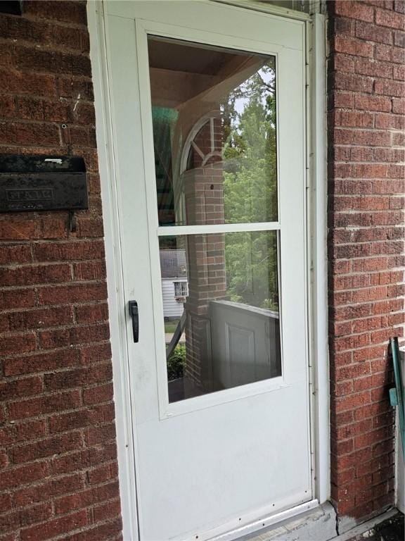 2945 Devlin St, Arlington, PA 15210 - view of exterior entry featuring brick siding
