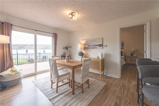 811 Sunset Cir Unit 811, Cranberry Twp, PA 16066 - dining space with a textured ceiling and light wood-type flooring