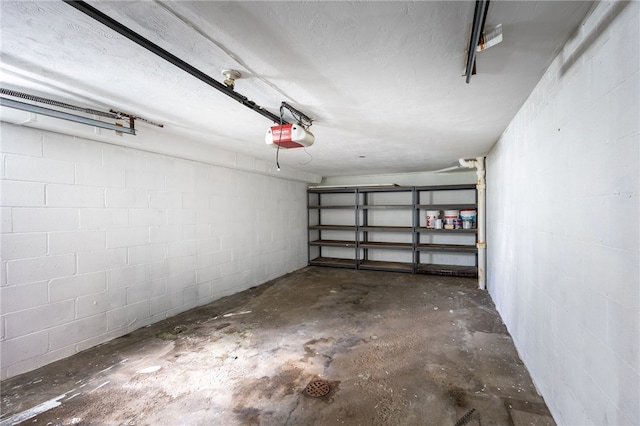 239 Pointview Rd, Brentwood, PA 15227 - garage with concrete block wall and a garage door opener