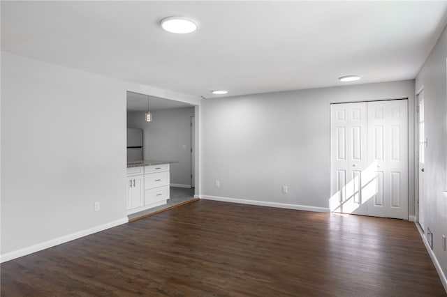 239 Pointview Rd, Brentwood, PA 15227 - unfurnished living room with dark wood-type flooring and baseboards