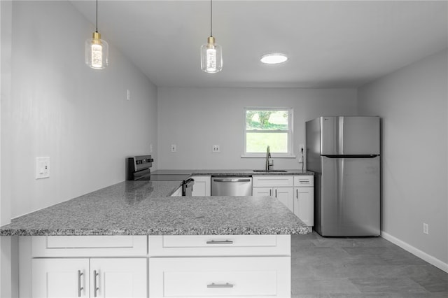 239 Pointview Rd, Brentwood, PA 15227 - kitchen featuring appliances with stainless steel finishes, white cabinets, a peninsula, and decorative light fixtures