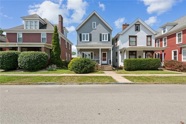 512 Alexander Ave, Southwest Greensburg, PA 15601 - view of front facade with covered porch and a front lawn