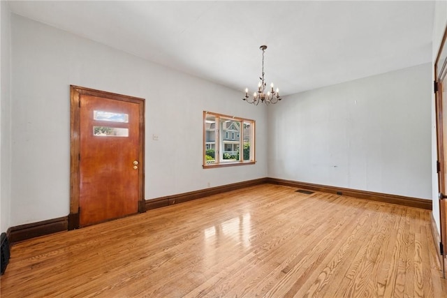 512 Alexander Ave, Southwest Greensburg, PA 15601 - unfurnished room with a chandelier and light wood-type flooring