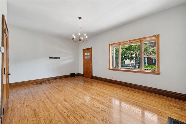 512 Alexander Ave, Southwest Greensburg, PA 15601 - empty room featuring a chandelier and light wood-type flooring
