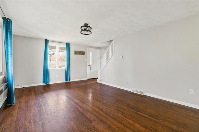 224 E End, Bullskin Twp, PA 15425 - unfurnished living room with stairs and wood finished floors