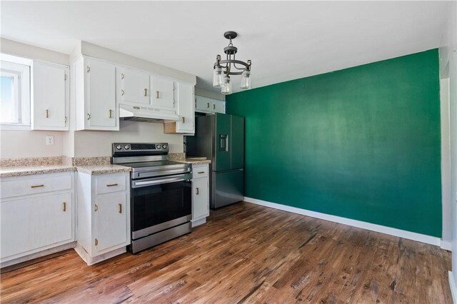 224 E End, Bullskin Twp, PA 15425 - kitchen with stainless steel electric range oven, under cabinet range hood, freestanding refrigerator, white cabinets, and light countertops