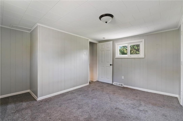 224 E End, Bullskin Twp, PA 15425 - unfurnished room with carpet floors, ornamental molding, and wood walls