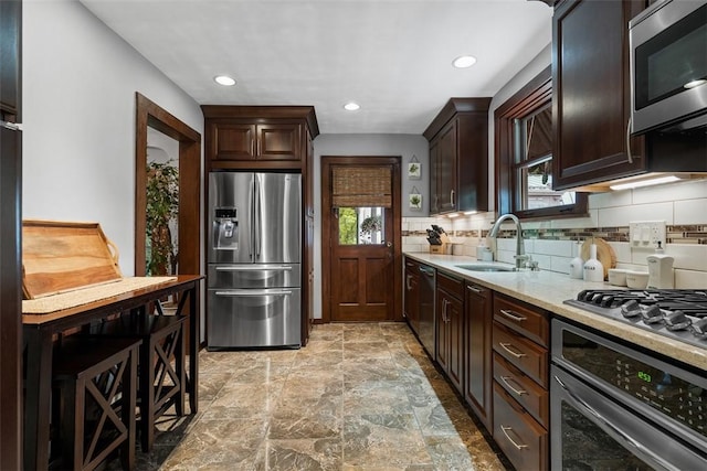 5517 Gibson Rd, Richland, PA 15044 - kitchen with stainless steel appliances, healthy amount of natural light, tasteful backsplash, dark brown cabinets, and recessed lighting