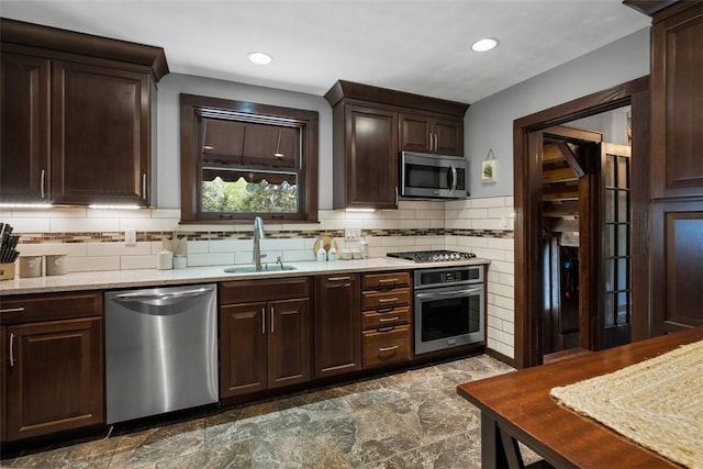 5517 Gibson Rd, Richland, PA 15044 - kitchen featuring appliances with stainless steel finishes, dark brown cabinetry, light countertops, backsplash, and recessed lighting
