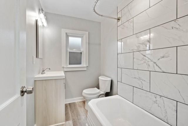 444 27th St, Mckeesport, PA 15132 - full bathroom with vanity and wood finished floors